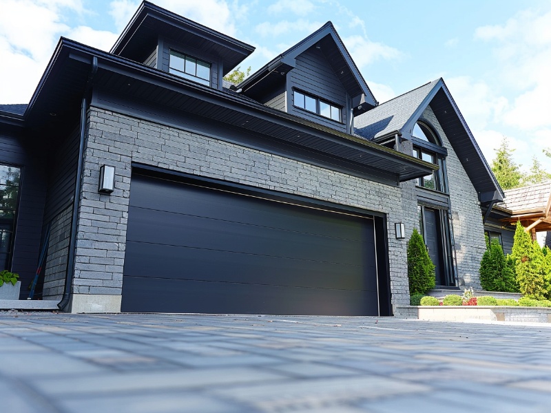 Insulated Raynor garage door from the Aspen Series, improving home energy efficiency.
