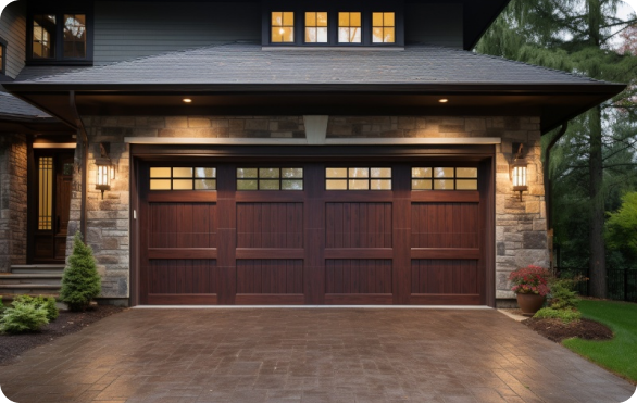 Modern home with a wooden double garage door and stylish exterior lighting.
